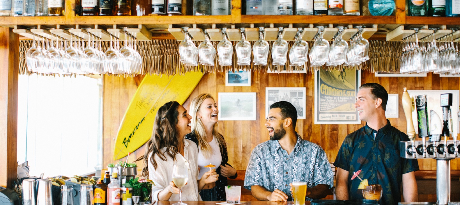 Guests at the surf-themed bar inside Duke's Malibu