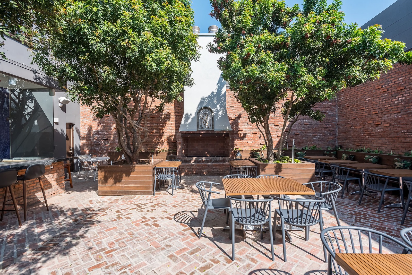 Tree-shaded brick patio at L'Antica Pizzeria da Michele in Hollywood